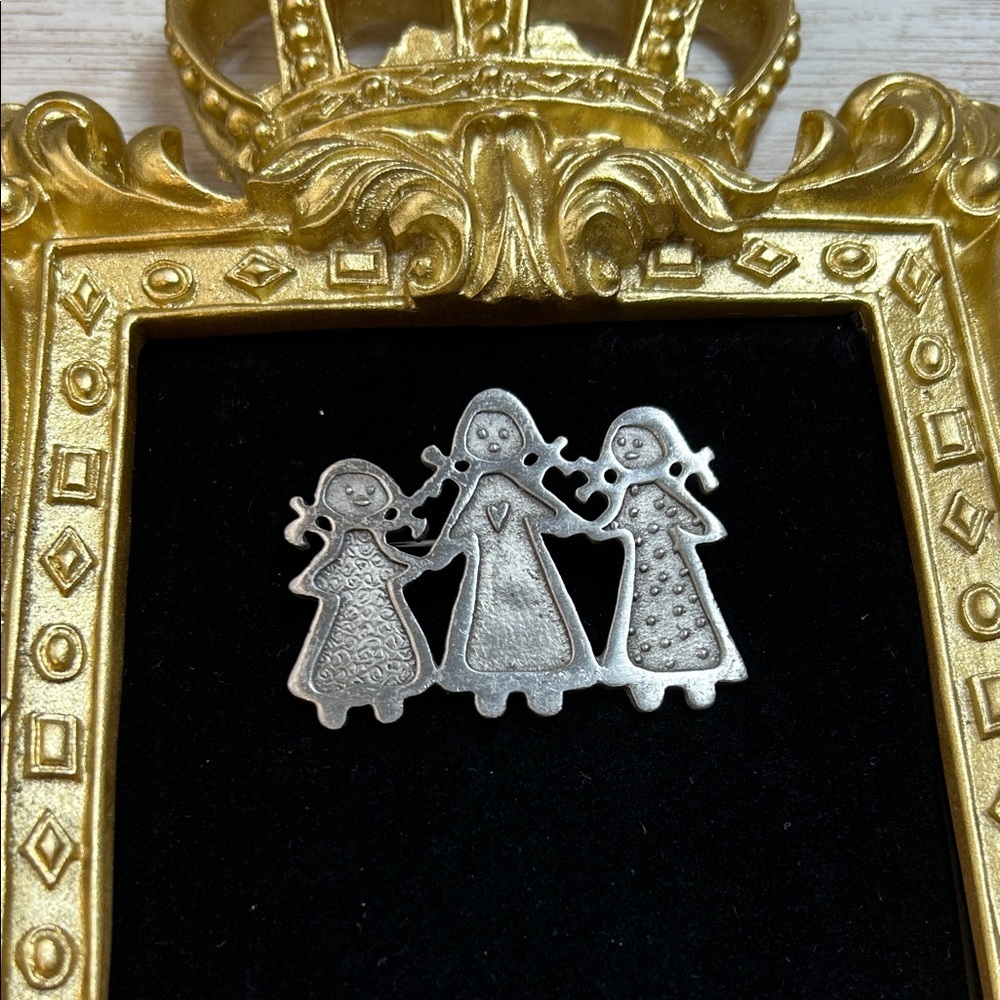 “Three Sisters" pewter brooch pin designed by Cynthia Webb
